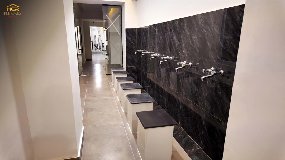 Hill Crest Residency wudu area with modern ablution facilities and marble finishes
